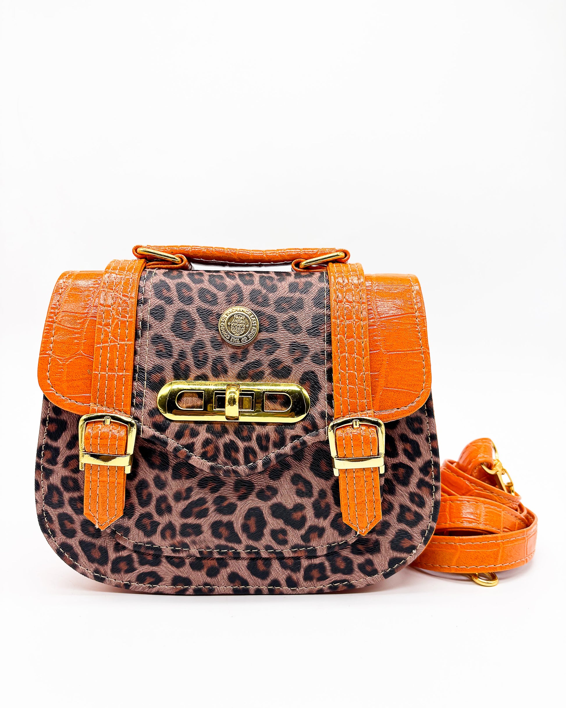 Leopard print handbag with orange accents on a white background